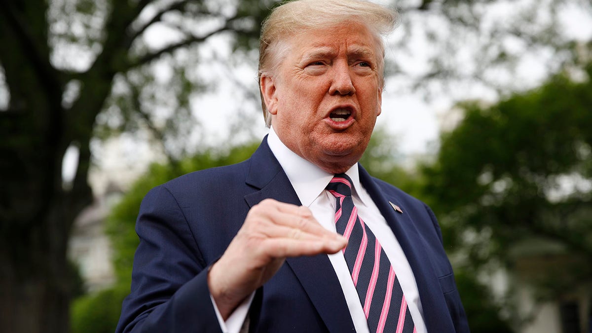 President Trump spoke to members of the media on the South Lawn of the White House in Washington on Tuesday before boarding Marine One for a short trip to Andrews Air Force Base, Md., and then on to Phoenix, Ariz. (AP Photo/Patrick Semansky)