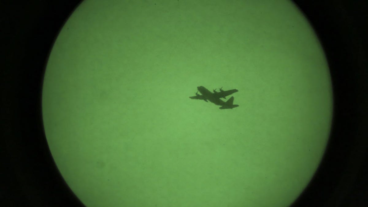An Air Force AC-130W assigned to Joint Special Operations Air Component passes over the amphibious transport dock USS New York (LPD 21) during an aviation operation in support of sea control training evolution May 19, 2020.