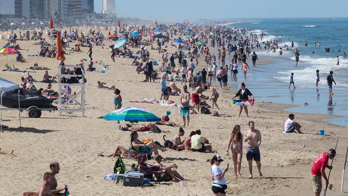 Warm weather draws crowds to the oceanfront, May 16 in Virginia Beach, Va. (Kaitlin McKeown/The Daily Press via AP)