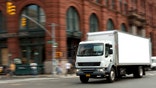 Truck speeding through Soho intersection in Manhattan.