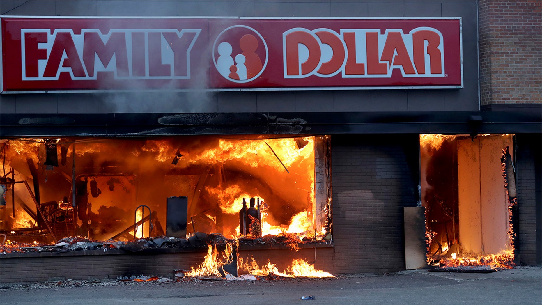 Fire burns inside The Family Dollar Store after a night of unrest and protests in the death of George Floyd early Friday, May 29, 2020 in Minneapolis. Floyd died after being restrained by Minneapolis police officers on Memorial Day. (David Joles/Star Tribune via AP)