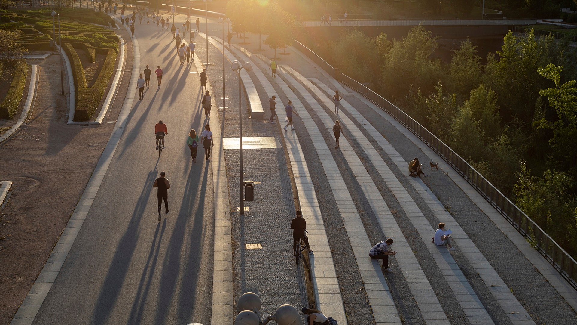 People exercise at Madrid Rio in Madrid, Spain, Saturday, May 2, 2020. 