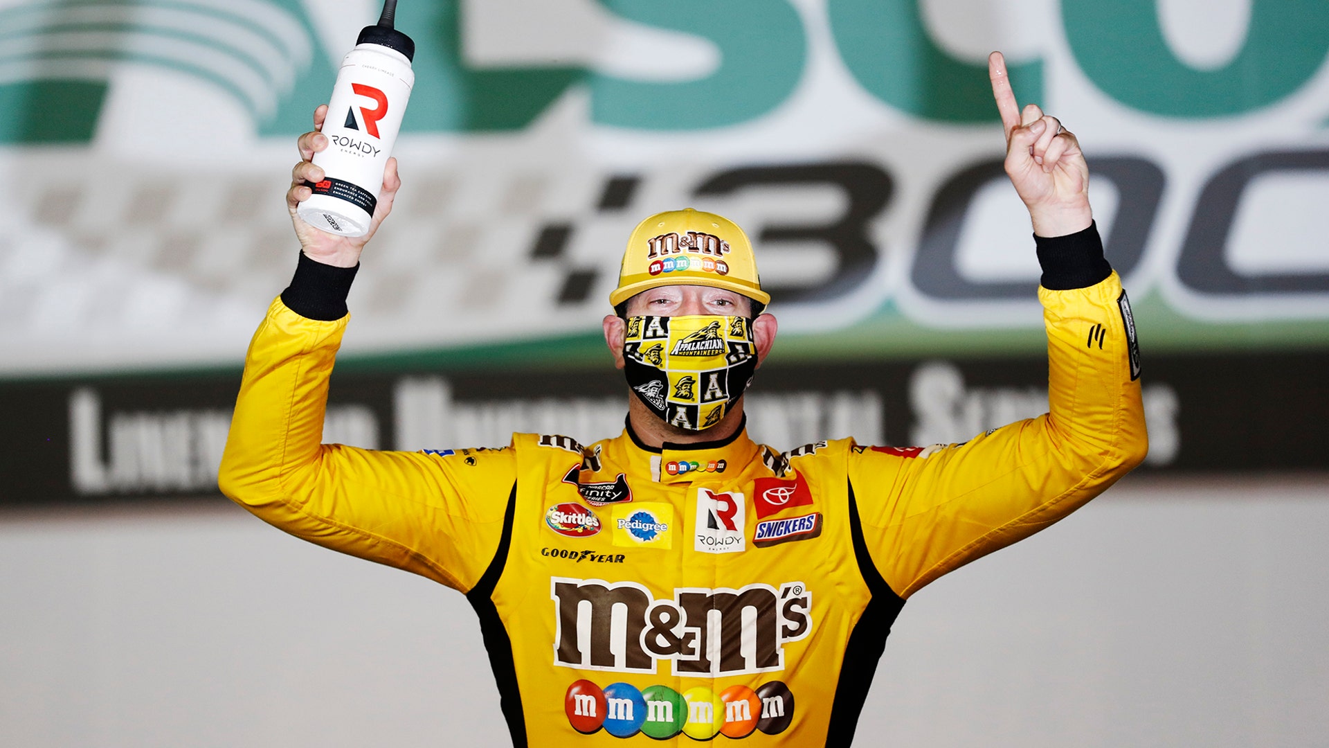 Kyle Busch celebrates after winning the NASCAR Xfinity Series auto race at the Charlotte Motor Speedway in Concord, N.C., May 25, 2020.