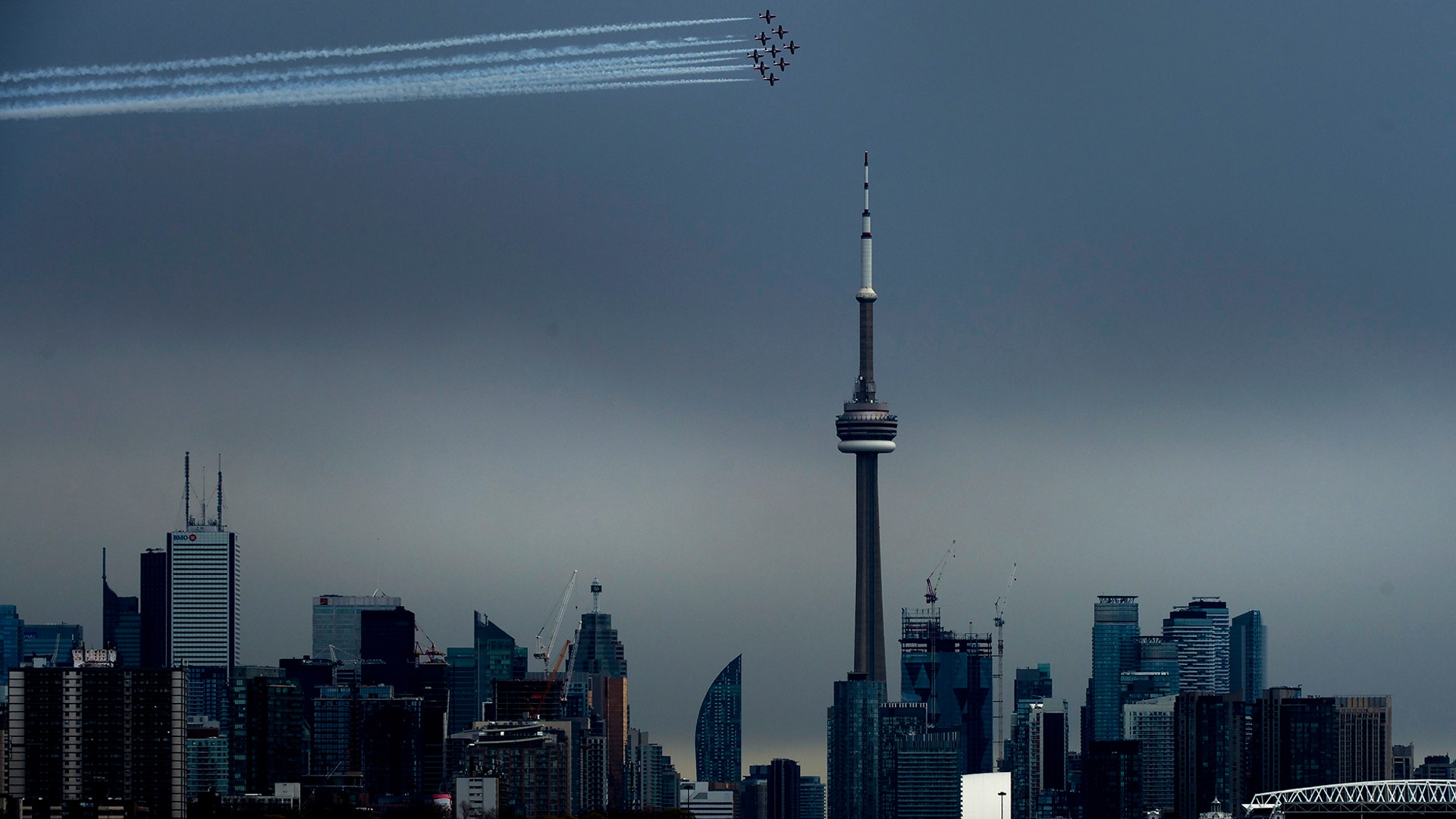 The Canadian Snowbirds circle the CN Tower as part of Operation Inspiration during the COVID-19 pandemic in Toronto, May 10, 2020. 