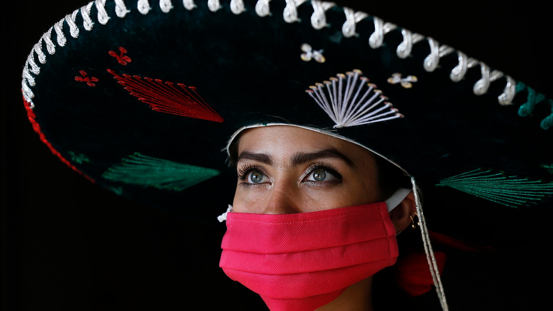 The Mariachi Duo Villa Maria singer Melissa Villar poses for a photo at her home in Mexico City, May 10, 2020. 