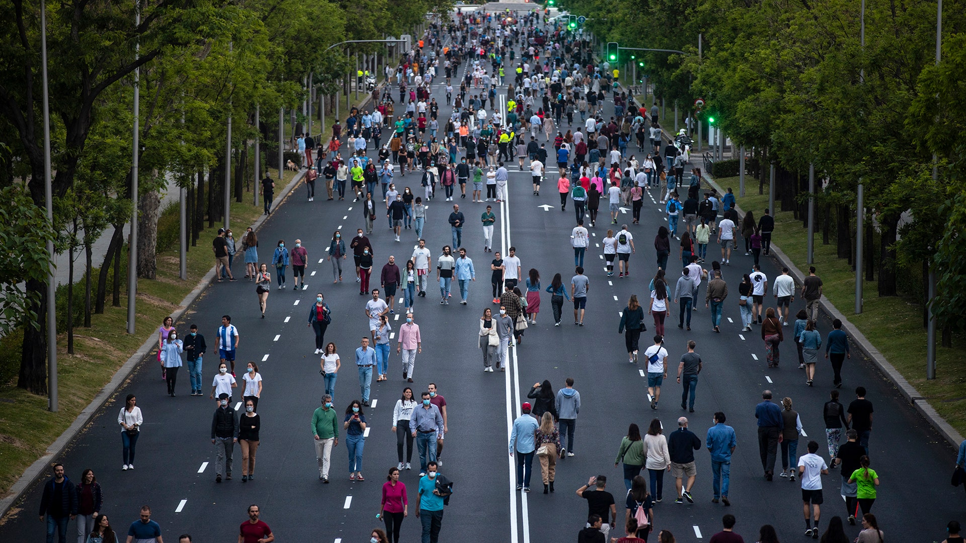 People exercise along Paseo de la Castellana in Madrid, Spain, May 9, 2020. 