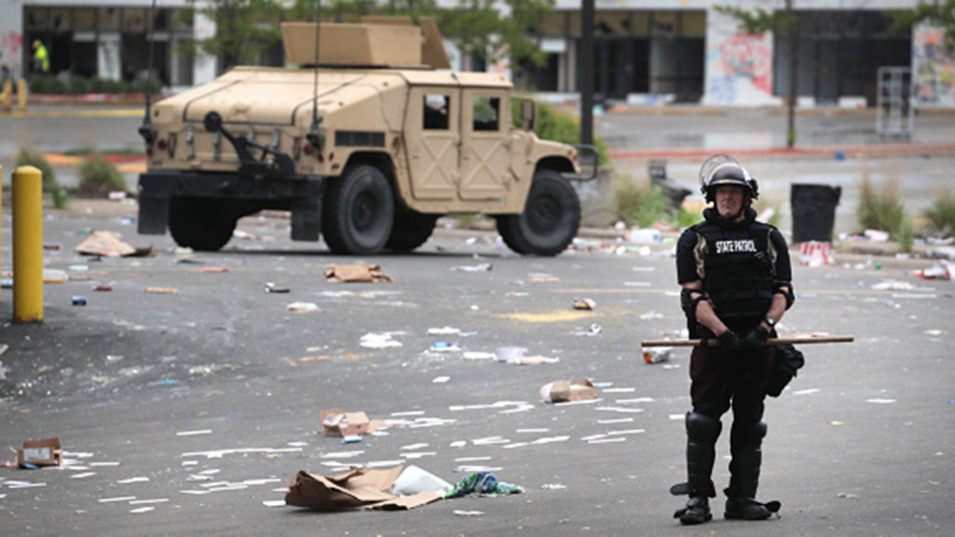 Police and national guard troops stand guard on May 29, 2020. Earlier today, former Minneapolis police officer Derek Chauvin was taken into custody for Floyd's death. Chauvin has been accused of kneeling on Floyd's neck as he pleaded with him about not being able to breathe. Floyd was pronounced dead a short while later. Chauvin and three other officers, who were involved in the arrest, were fired from the police department after a video of the arrest was circulated.