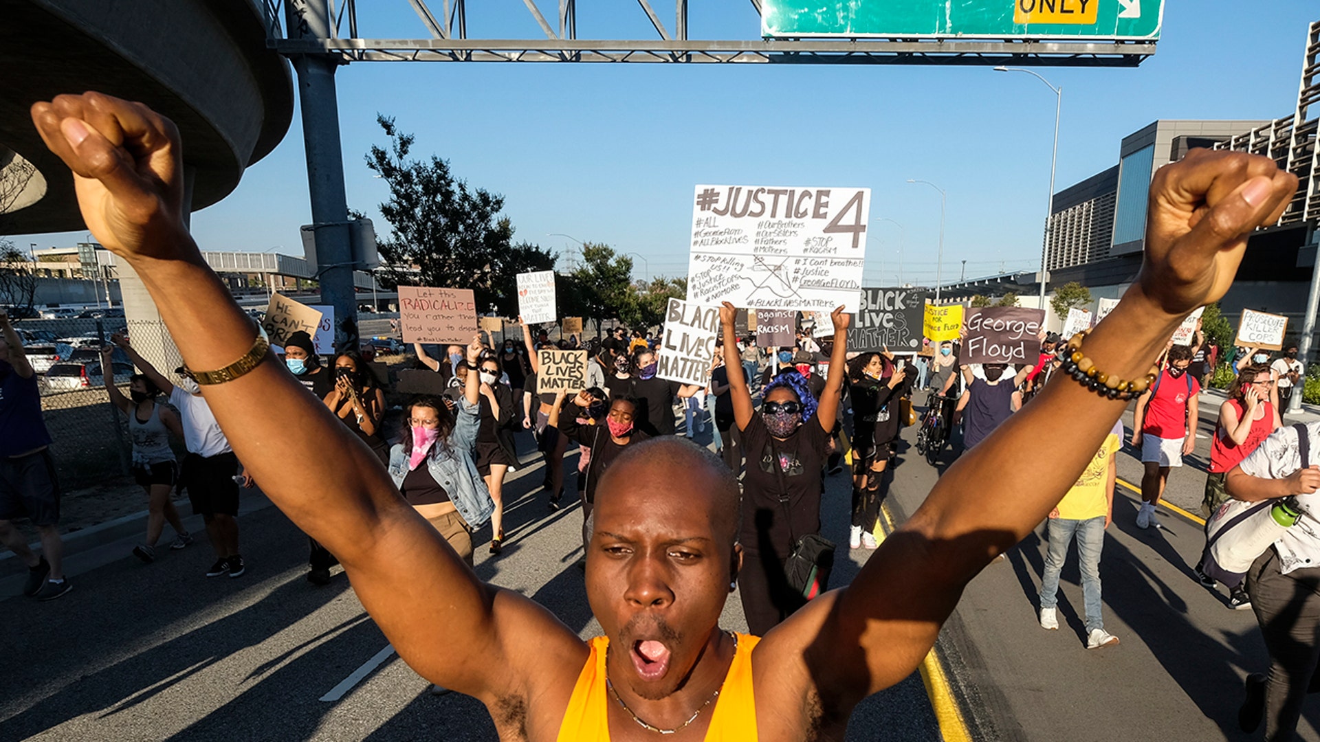 Demonstrators march during a protest of the death of George Floyd, a black man who was in police custody in Minneapolis, in downtown Los Angeles, Wednesday, May 27, 2020.