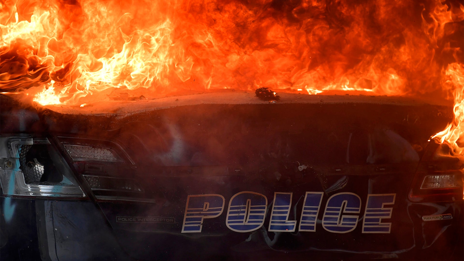 An Atlanta police vehicle on fire.