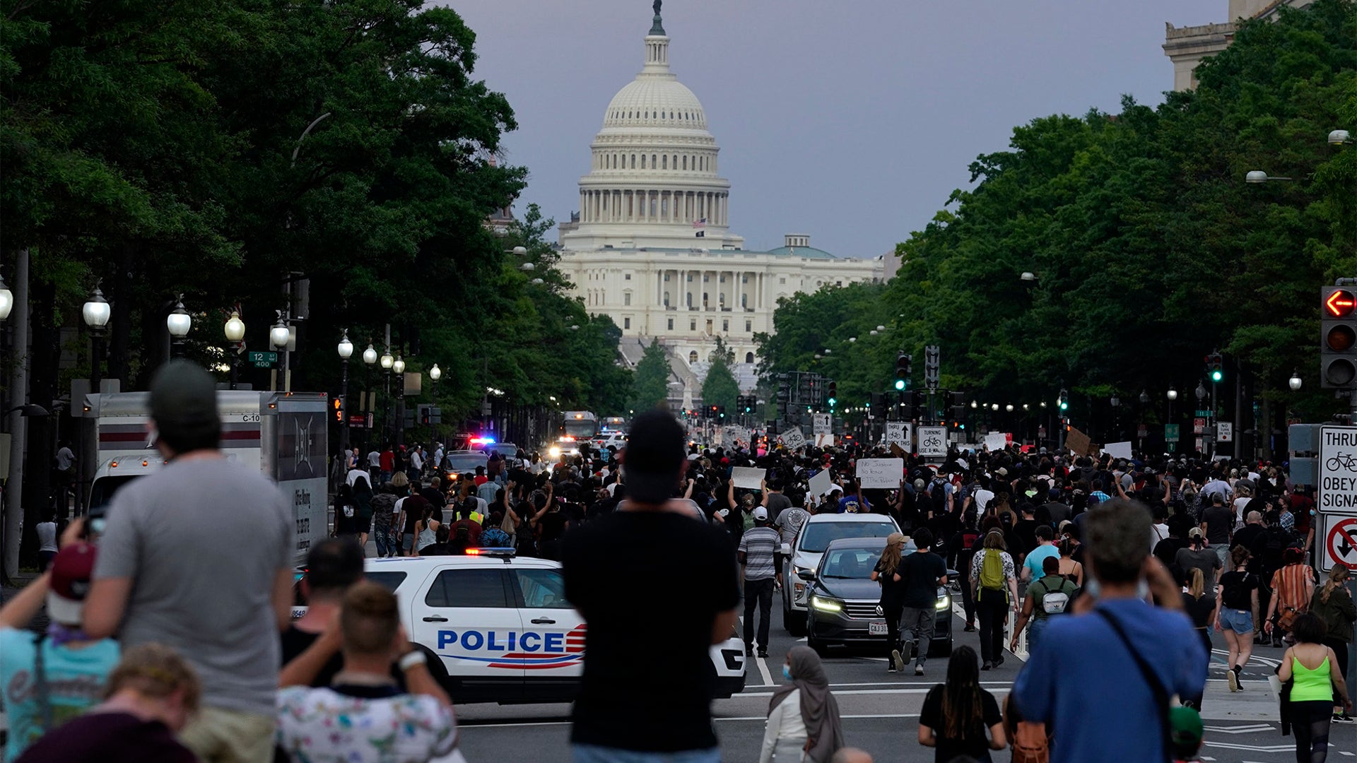 Demonstrators walk along Pennsylvania Avenue in Washington D.C.