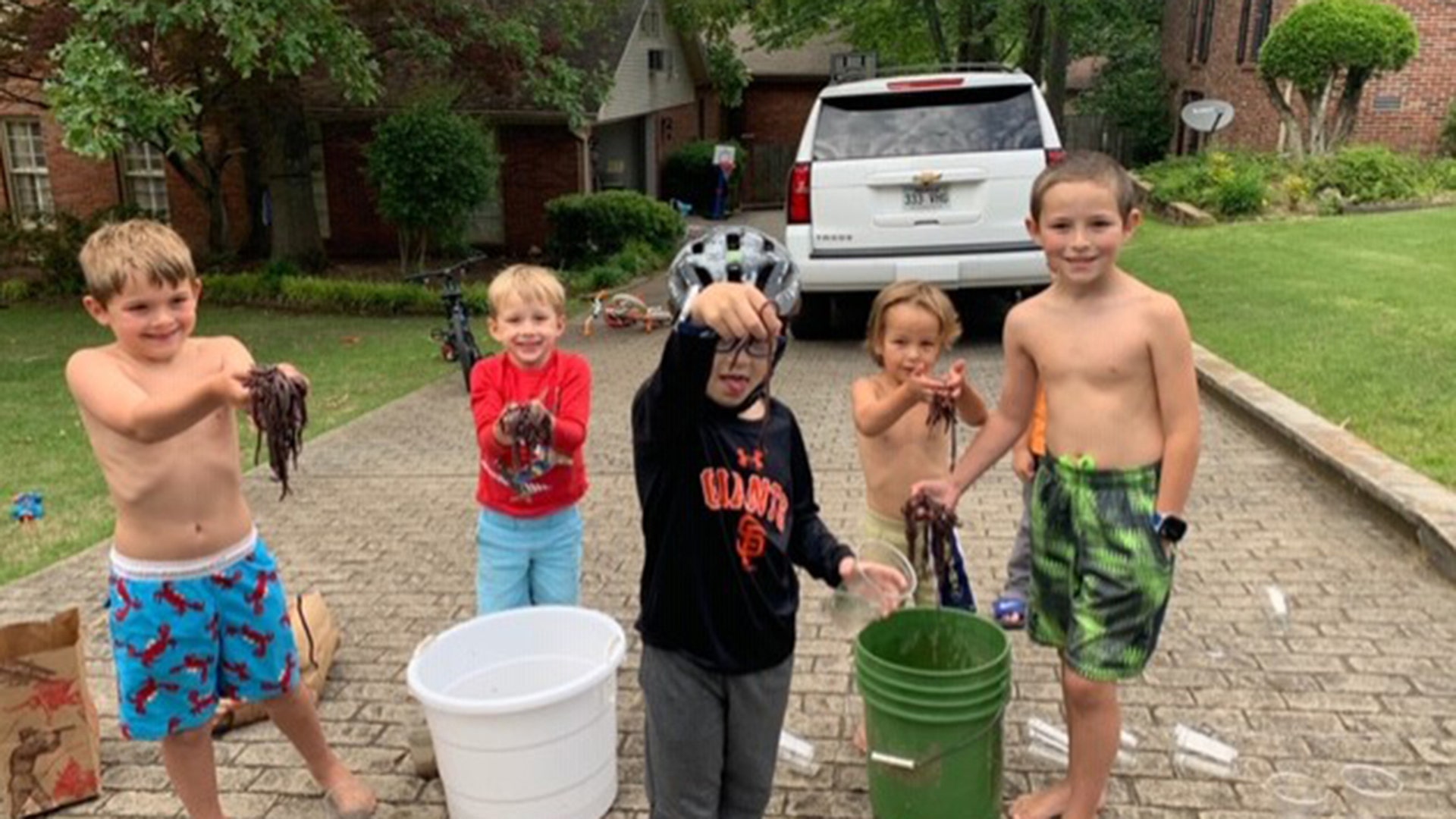 Worms !! DIY slip n slide brought out the worms ! Little Rock ,Arkansas Shelton family ( my grandkids are the 2 boys on left)