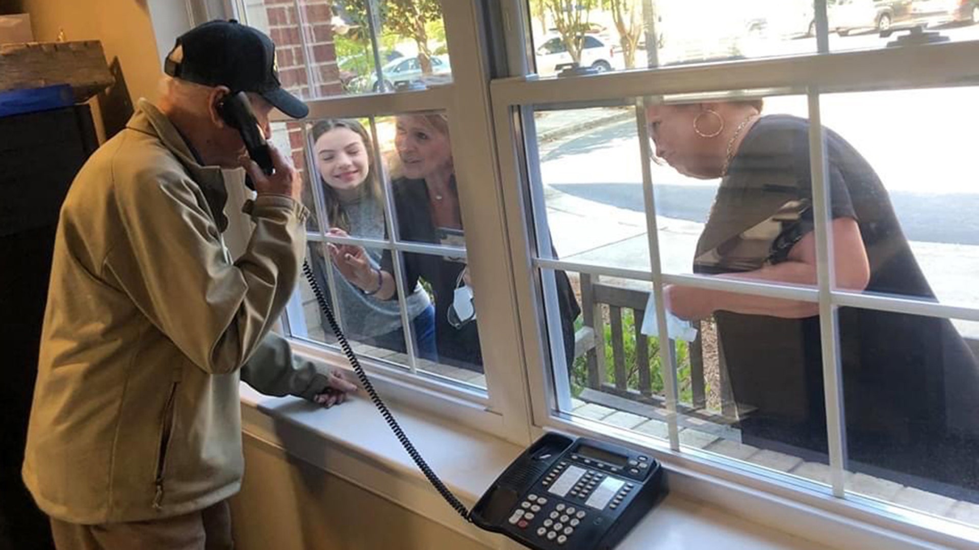 Just wanted to send pictures of my family going to see my dad and taking food to the staff at the retirement center where he is at. His name is Bill Whitley and he is 96 years old get ready to turn 97 on May 19. His father started our family business whitley’s Funeral Home back in 1913 and my father took it over. We miss him so much because we are so used to taking him to his favorite restaurants in town and bringing him his favorite candy and that we cannot do now He doesn’t fully understand what is going on. This moment was sweet and sad at the same time because as you can see I Cannot touch him or give him a hug. Everyone in my small hometown knows him because he is the funeral director as he is referred to. This is very hard on my family because we worry about him but at the same time we have to carry on our business of running the funeral home with the Quarantine going on. Just wanted to share our pictures with everyone thank you very much Jane Whitley