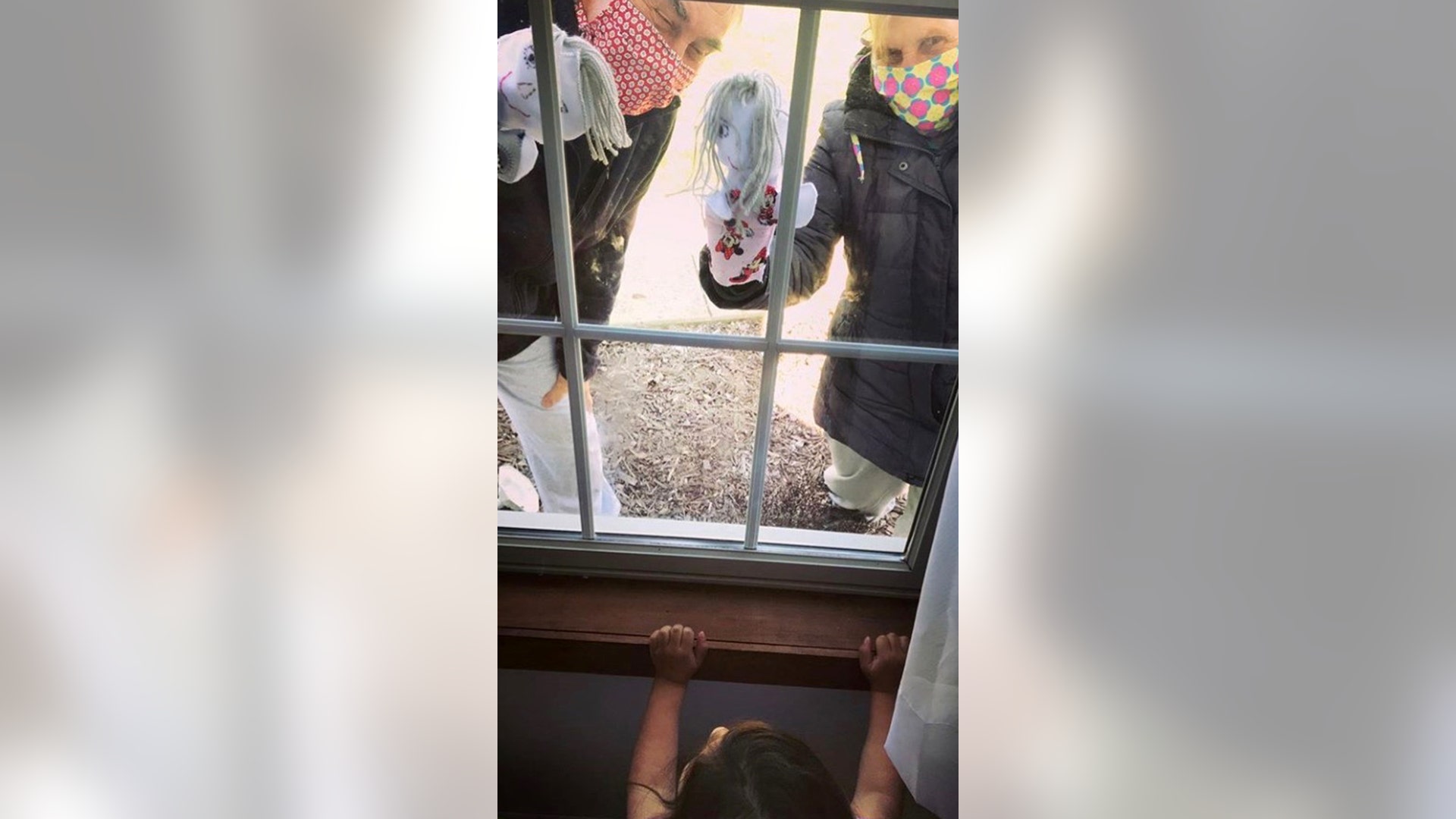 This is my sister visiting her grandchildren in Windham. She made the puppets and masks and gave her grandchildren a puppet show from outside the window.