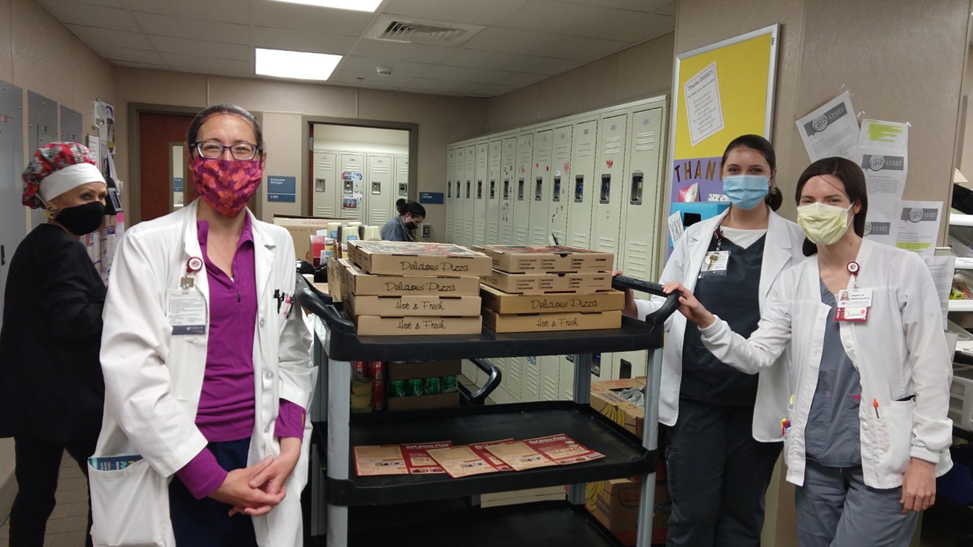 My daughter Lindsay is a clinical dietitian at Park West hospital in Knoxville, Tennessee. While they have not had a major influx of COVID-19 patients, the atmosphere and stress level is very tense. As a small gesture of thanks to these brave men and women, I had pizzas sent from a local restaurant for her department and related colleagues. Attached are photos of them receiving and enjoying them! My daughter is on the far right in Photo #1. A special shout-out to The Red Onion restaurant in Knoxville for going above and beyond. The owner's wife sewed and gave my daughter a mask, and the owner included a homemade card expressing my thanks for the work Lindsay and her colleagues are doing. They are my heroes.