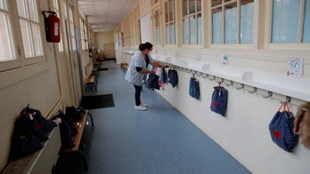 French preschoolers seen isolating inside chalk squares as coronavirus restrictions ease