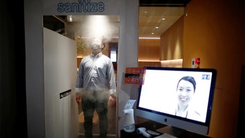Tokyo pub installs machine to spray customers with disinfectant for 30 seconds