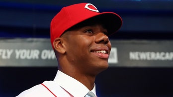 Reds' pitching prospect Hunter Greene fires baseball through car window
