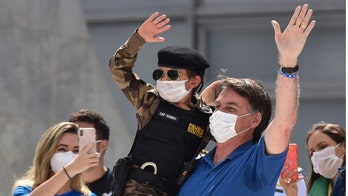 Brazil's Bolsonaro flouts social distancing, poses for pics with kids as São Paulo health system reaches near collapse