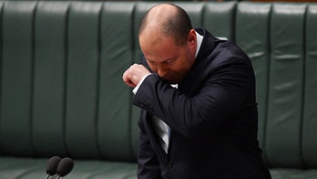 Australia's treasurer tested for coronavirus after coughing spell during speech on virus