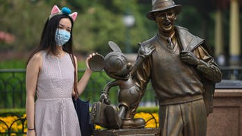 Shanghai Disneyland: Photos of reopened park show social-distancing markers, half-empty rides