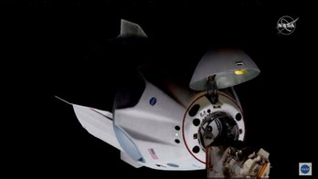 SpaceX spacecraft docks with International Space Station on historic NASA mission