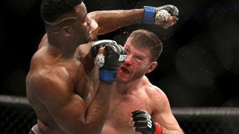 UFC champ Miocic welcomes octagon's return, has concerns