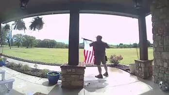 Video of UPS driver fixing rolled-up American flag goes viral