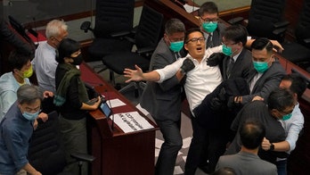 Hong Kong pro-democracy lawmakers dragged out of legislative session before pro-Beijing camp elects chair