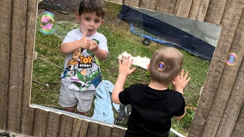 Neighboring moms install clear acrylic panel fence so their children can keep playing together