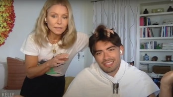 Kelly Ripa gives son Michael Consuelos a haircut with kitchen scissors on 'Live' show