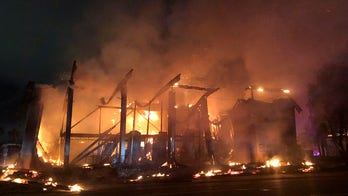 2 banks burn to ground in San Diego suburb as protests turn to violence, looting