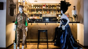 Lithuania restaurants using mannequins at empty tables to model local designers' fashions