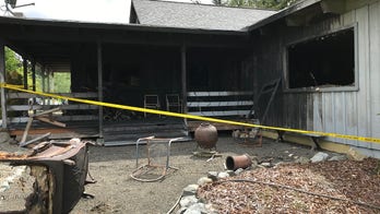 Washington man arrested after grandparents' bodies found in burned-out home, police say