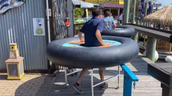 Maryland bar reveals 'social distancing tables' with inner tube bumpers for customers to wear once it reopens