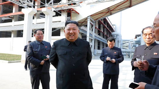 North Korea releases pictures showing Kim Jong Un's first public appearance in weeks