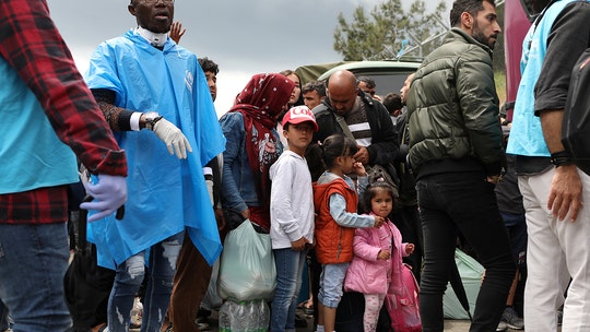 Greece ships hundreds of migrants to mainland amid coronavirus overcrowding fears in Lesbos camp