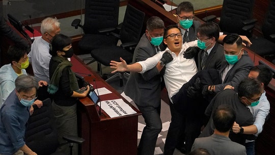 Hong Kong pro-democracy lawmakers dragged out of legislative session before pro-Beijing camp elects chair