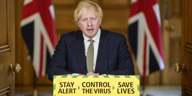 Britain's Prime Minister Boris Johnson speaking during a briefing on the coronavirus in London on Sunday. (Andrew Parsons/10 Downing Street via AP)