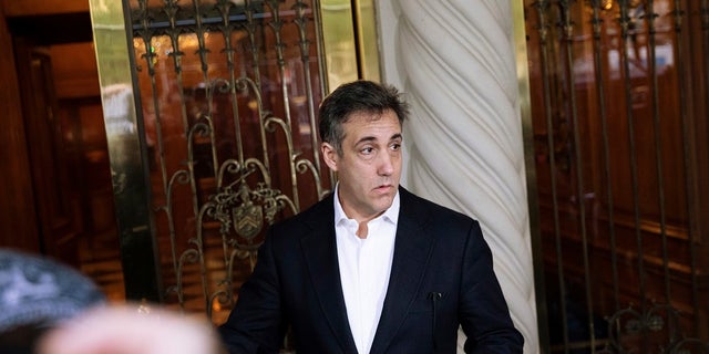 Michael Cohen, former attorney to President Donald Trump, holds a press conference outside his apartment building before departing to begin his prison term in New York State. 