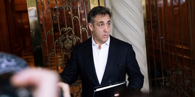 Michael Cohen, former attorney to President Donald Trump, holds a press conference outside his apartment building before departing to begin his prison term in New York State.