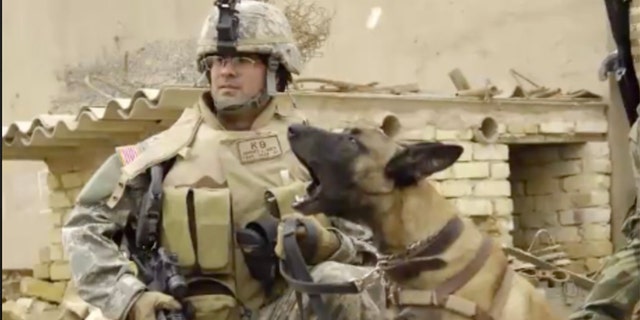 U.S. Air Force Tech. Sgt. Harvey Holt and his military working dog Jackson