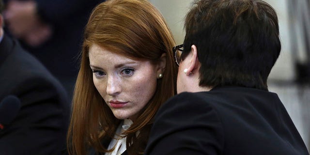 Katie Brennan, left, chief of staff at the New Jersey Housing and Mortgage Finance Agency, listens while testifying before the Select Oversight Committee at the Statehouse in Trenton, N.J., Dec. 4, 2018. (Associated Press)