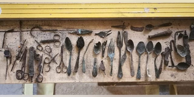 Items hidden by prisoners found in Block 17 of the former Auschwitz main camp, April 21, 2020.