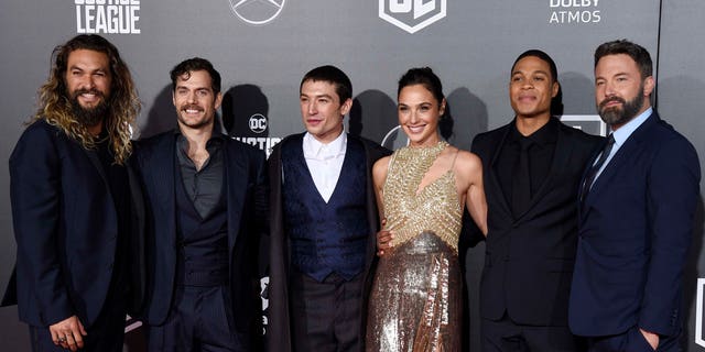 The cast of "Justice League," from left, Jason Momoa, Henry Cavill, Ezra Miller, Gal Gadot, Ray Fisher and Ben Affleck, pose at the premiere of the film in Los Angeles. (Photo by Chris Pizzello/Invision/AP)