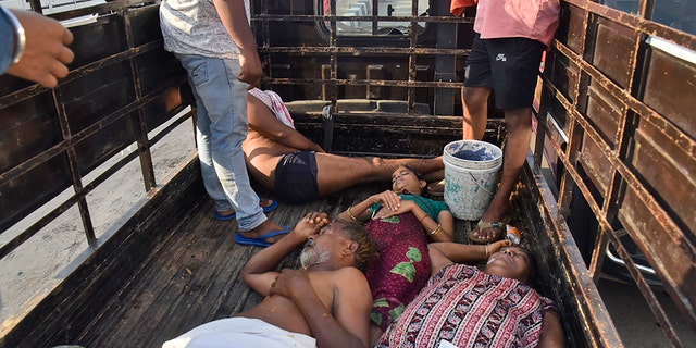 People affected by a chemical gas leak are carried in a truck for medical treatment in Vishakhapatnam, India, Thursday, May 7, 2020. Chemical gas leaked from an industrial plant in southern India early Thursday, leaving people struggling to breathe and collapsing in the streets as they tried to flee. Administrator Vinay Chand said several people fainted on the road and were rushed to a hospital. (AP Photo)