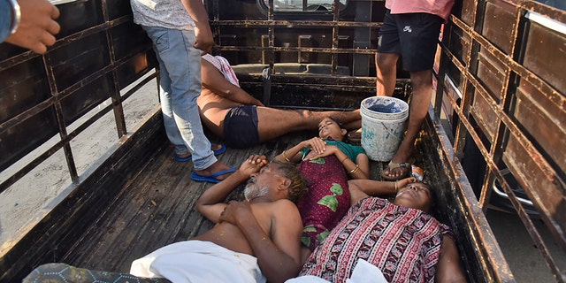 People affected by a chemical gas leak are carried in a truck for medical treatment in Vishakhapatnam, India, Thursday, May 7, 2020. Chemical gas leaked from an industrial plant in southern India early Thursday, leaving people struggling to breathe and collapsing in the streets as they tried to flee. Administrator Vinay Chand said several people fainted on the road and were rushed to a hospital. (AP Photo)
