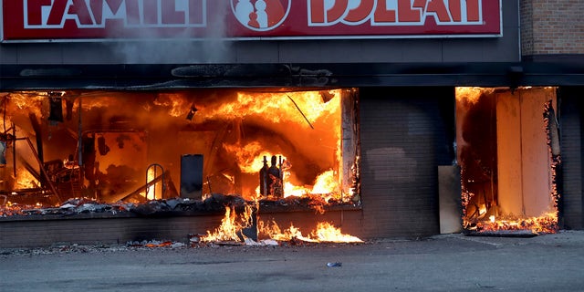 Fire burns inside The Family Dollar Store after a night of unrest and protests in the death of George Floyd early Friday, May 29, 2020 in Minneapolis.