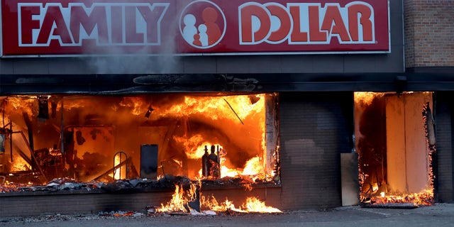 Fire burns inside The Family Dollar Store after a night of unrest and protests in the death of George Floyd early Friday, May 29, 2020 in Minneapolis.