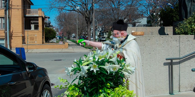 Viral: Priest Sprays Holy Water From Toy Gun To Maintain Social Distancing