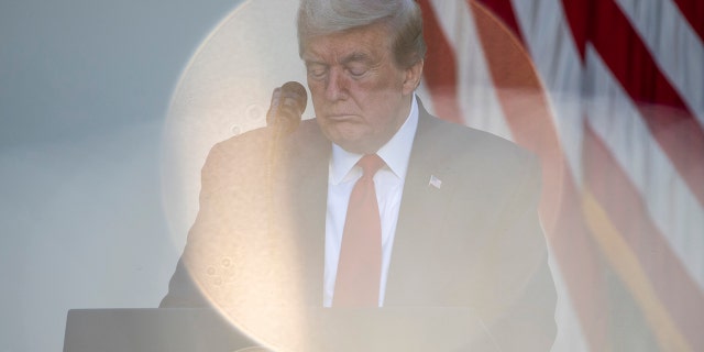 President Donald Trump bows his head in prayer during a White House National Day of Prayer Service in the Rose Garden of the White House, May 7, in Washington. (AP Photo/Alex Brandon)